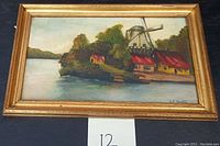 Framed oil painting signed C. F. Heath showing cottages and windmill landscape