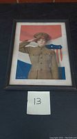 Frontal view of the framed WW1 female US soldier saluting print.