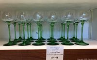 Full set of 18 glasses displayed on shelf