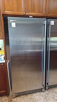 Exterior view of stainless steel freezer in kitchen cabinetry