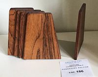 Side view of rosewood bookend panel showing taper from bottom to top and wood grain pattern.