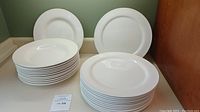 Stack of 12 dinner plates and 12 bowls