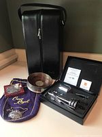 Full set including Danier leather wine bottle carrier, metal wine bottle tags, metal holder, and Crown Royal bags.