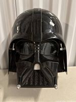 Front view of Darth Vader mask showing detailed grille and eye shield.