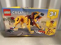Front of box showing LEGO Creator 31112 Wild Lion 3-in-1 set with lion build and brick count 224, suitable for ages 7+.
