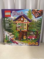Front of LEGO Friends 41679 Forest House sealed box showing the assembled set, age recommendation, piece count, and LEGO Friends logo.