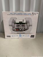 Back side of the boxed Ollie RC vehicle showing mechanical details and features like drive, drift, customize, crash, launch, with price sticker.