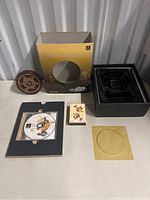 Full lot with game disc, case, original box, collectible cards, and clock