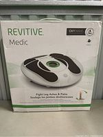 Photo of the Revitive Medic Circulation Booster device box showing product image and details.