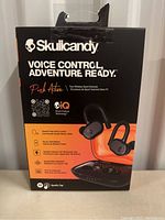 Front view of Skullcandy Push Active earbuds box showing branding, key features like voice control and long battery life.