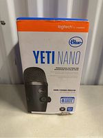 Front of the box showing Blue Yeti Nano microphone image and branding
