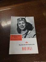 Cover page of the souvenir booklet showing a woman in traditional Mohawk dress and the title 'Royally-Deeded Land of the Mohawks'.
