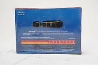 Front view of sealed Linksys Cisco WUSB600N retail box showing product image and basic features.