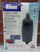 Front packaging of new old stock Targus PA104U Auto/Air Notebook Power Adapter showing compatibility with Compaq Armada series laptops and highlighting the product features.