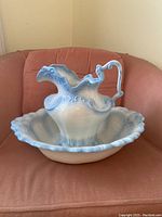 Pitcher and basin set arranged with pitcher inside basin, showing ruffled detail on pitcher and scalloped edges of basin