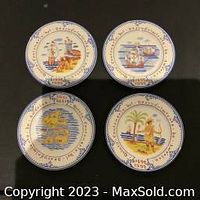 Top-down view of all four Tiffany & Co. plates arranged as a set, showing all designs clearly.