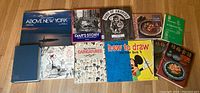 Full lot of 11 vintage books displayed on wooden floor, showing covers with various themes including drawing, cooking, and collectors.