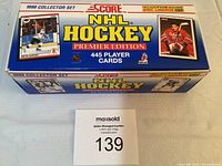 Box of 1990 Score NHL Hockey Premier Edition with 445 player cards, showing box top with card images including Eric Lindros.