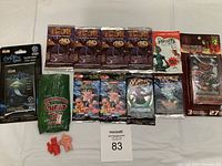 Overview of all trading card packs and collectibles included in the lot, showing unopened packages from various brands including IGOR, Robots, Garbage Pail Kids, Cardfiffusa, and small figures.