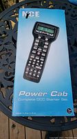 Box showing product image, brand, and product name indicating it is a NCE Power Cab Complete DCC Starter Set.