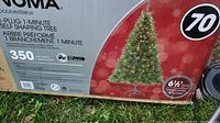 Box label showing Noma brand, 6.5 feet tall prelit Christmas tree with 350 mini lights and diameter 47 inches (120 cm).