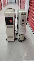 Photo of both portable electric radiators side by side showing front and back views.