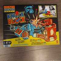 Front of sealed Rock 'Em Sock 'Em Robots Knock or Block game box showing artwork and branding.