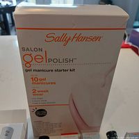 Box of Sally Hansen Salon Gel Polish gel manicure starter kit showing product branding and features