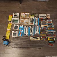 Overview of all locomotives, rolling stock, track components and accessories on floor