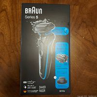 Front of Braun Series 5 electric shaver box showing shaver image and key features such as lithium-ion battery, wet or dry use, model 5018s.