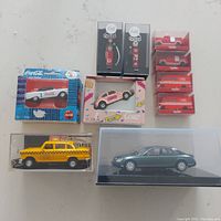 Top view of all diecast vehicles and fuel pumps in boxes showing variety and packaging