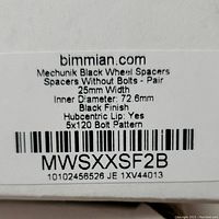 Label on box showing product details: Mechunik Black Wheel Spacers, pair without bolts, 25mm width, 72.6mm inner diameter, black finish, hubcentric lip, 5x120 bolt pattern.