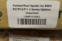 Close-up of box label indicating Painted Roof Spoiler for BMW F07/F10/F11 5 Series with option Unpainted.