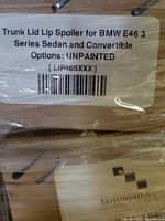 Label reading 'Trunk Lid Lip Spoiler for BMW E46 3 Series Sedan and Convertible Options: UNPAINTED [LIP46SXXX]'