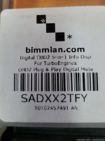 Label showing model for turbo engine OBD2 meter by bimmian.com with barcode and serial numbers