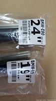 Photo showing 19-inch and 24-inch BMW E90 windshield wiper blades in sealed packaging.