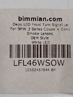 Label showing DEPO LED front turn signal for BMW 3 Series Coupe and Convertible, smoke lenses, OEM style, white LED