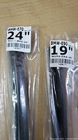 Two sealed windshield wiper blades, labeled BMW-E70 24 inch and BMW-E90 19 inch, packaged individually in clear plastic.
