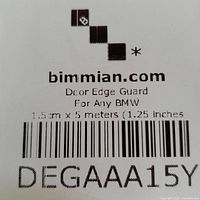 Close-up of product label showing brand bimmian.com, product name Decor Edge Guard for Any BMW, dimensions 1.5cm x 5 meters (1.25 inches), and barcode.