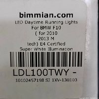 Label on box showing bimmian.com branding with product details: LED Daytime Running Lights for BMW F10 2010-2013 M-Tech, E4 Certified, Super White Illumination.