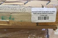 Close-up of label on box indicating painted trunk lid lip spoiler for BMW E39 5 Series, unpainted, with product code LIP391XXX.