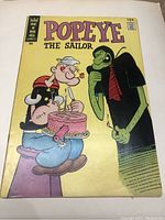 Front cover of Popeye The Sailor comic book issue 124 showing characters and title.