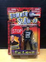 Front view of packaged Shane McMahon action figure from SummerSlam 1999 with visible branding and figure wearing a 'Generate Punk' shirt.