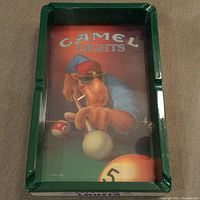 Top view of the rectangular green plastic ashtray showing the Camel Lights design with camel character playing billiards inside.