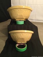 Two yellow Gripstand bowls stacked, showing exterior sides and pattern