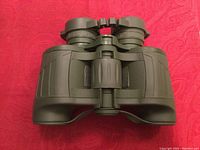 Top view of Yukon Gear 7x32 green binoculars showing eyepieces and focus mechanism.