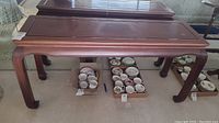 Vintage solid wood sofa table with dark brown finish and cabriole legs, showing overall wear.