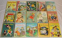 Photo of the front covers of the 15 children's Little Golden Books showing colorful illustrated designs and titles.