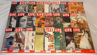 Photo showing all 24 Life magazines arranged in 3 rows, colorful and black-and-white covers featuring landscapes, wildlife, deer, people and cultural images