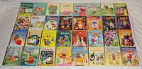 Array of 32 Little Golden Books including Star Wars, Ghostbusters, Disney characters, and others.